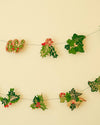 Decorative holly berry garland on a beige background