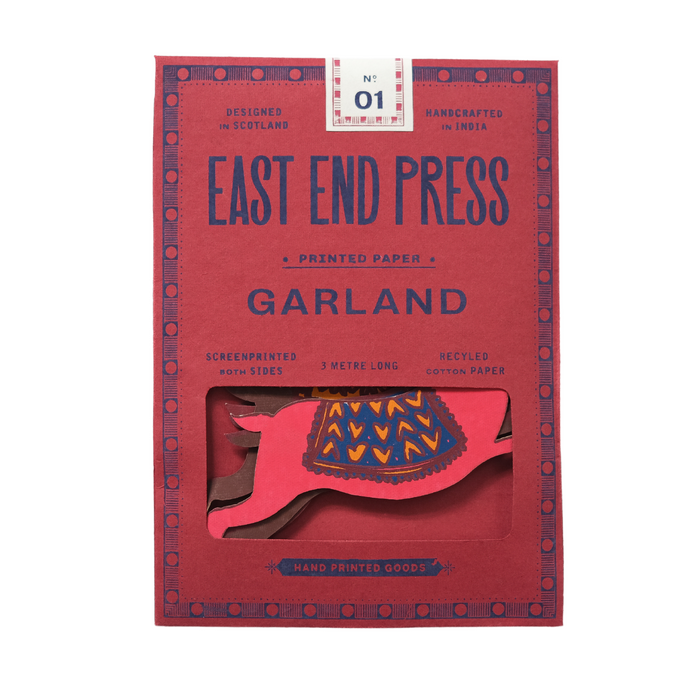 Red packaging of East End Press Garland with printed paper inside | East End Press | Shop Fodder