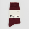 Maroon sock with a white label displaying 'Pairs' on a light gray background. Pairs Socks | Shop Fodder