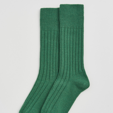 Pair of green socks on a light gray background | Pairs Socks | Shop Fodder