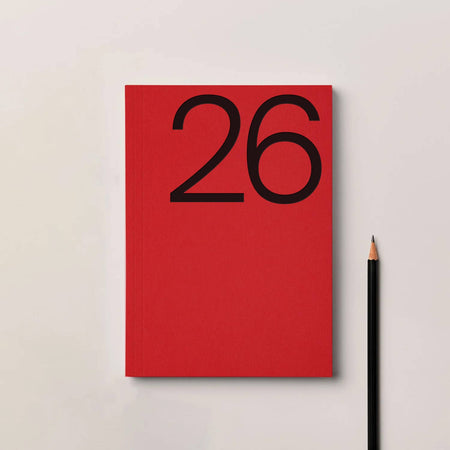 Red notebook with the number 26 on a light gray background. 2026 Diary Red | Kinshipped |Shop Fodder