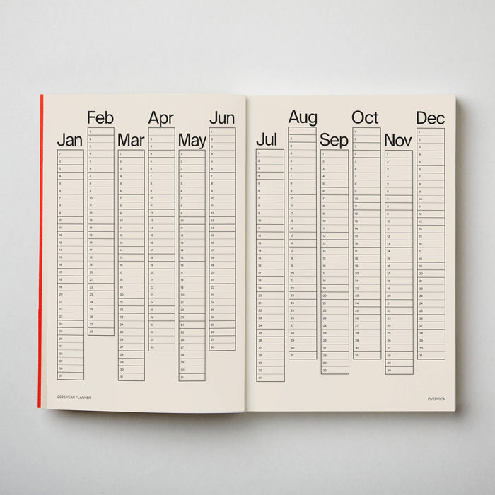 Open planner showing a yearly calendar layout on a light grey background. 2026 Planner | Kinshipped | Shop Fodder