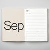 Open planner showing September layout on a gray background. 2026 Planner | Kinshipped | Shop Fodder