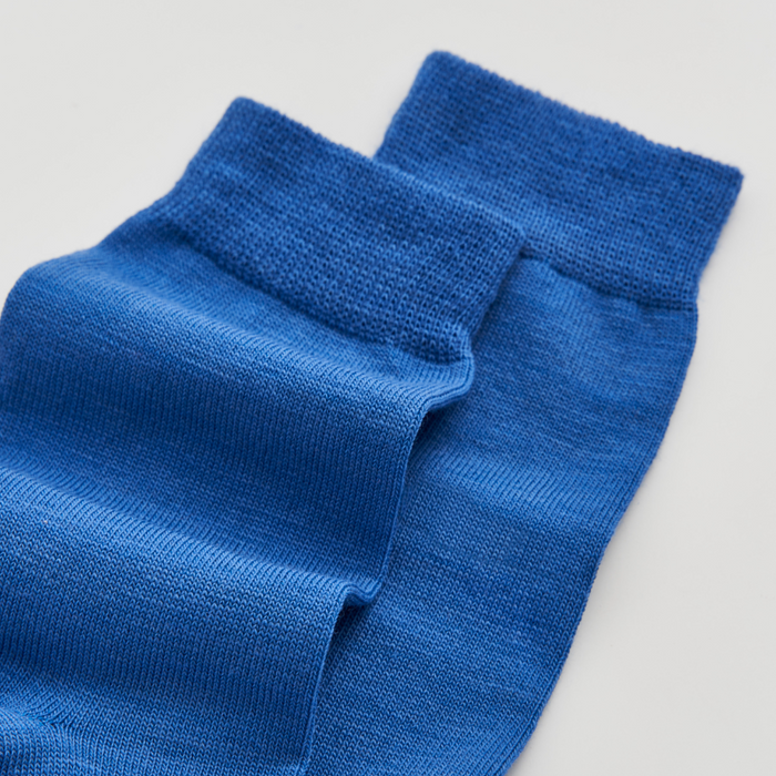 Pair of blue socks on a light gray background | Pairs Socks | Shop Fodder