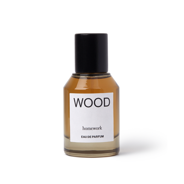 Perfume bottle labeled 'WOOD' by 'homework' on a white background | Homework Store | Shop Fodder