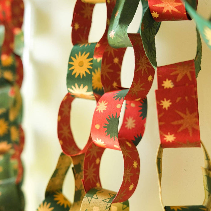 Decorative paper chain with festive patterns on a white background. East End Press | Shop Fodder
