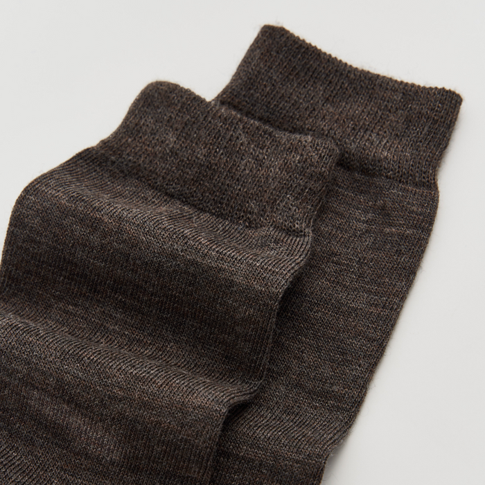 Pair of dark gray socks on a light gray background | Pairs Socks | Shop Fodder