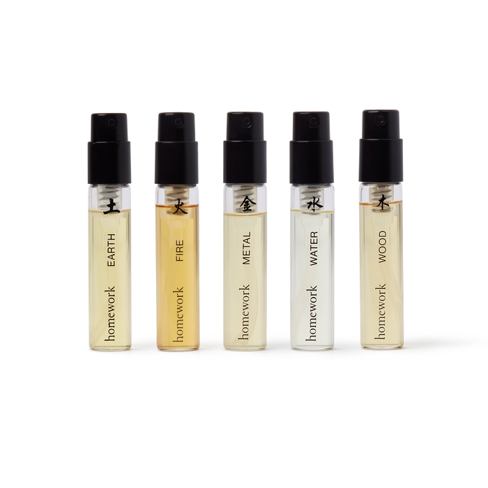 Five small perfume bottles labeled 'Earth', 'Fire', 'Metal', 'Water', and 'Wood' by 'homework' on a white background. | Homework Store | Shop Fodder