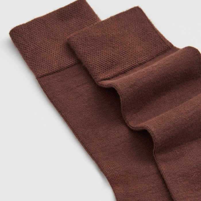 Pair of brown knee-high socks on a light gray background | Pairs Socks | Shop Fodder