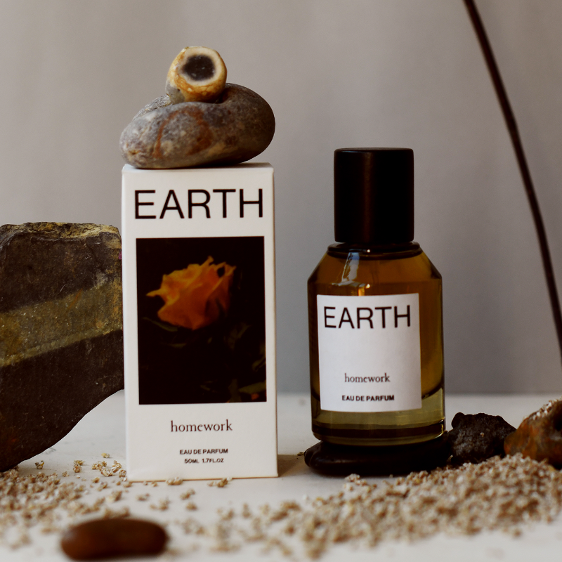 Earth-themed perfume bottle and packaging with natural elements on a neutral background | Homework Store | Shop Fodder