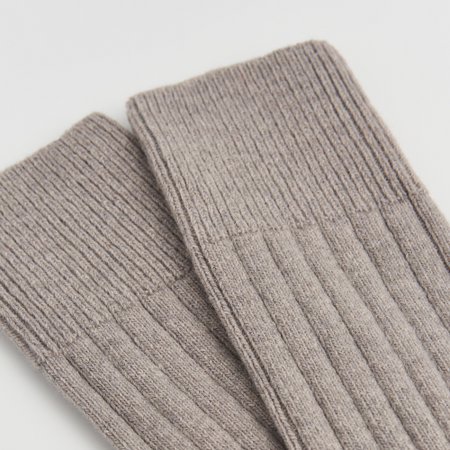 Pair of gray ribbed socks on a light gray background.  Pairs Socks | Shop Fodder