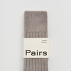 Gray sock with 'Pairs' label on a light gray background. Pairs Socks | Shop Fodder