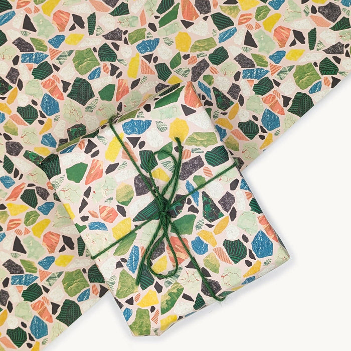 Colorful terrazzo-patterned paper with a tied green string on a white background.  | Hadley Paper Goods | Shop Fodder