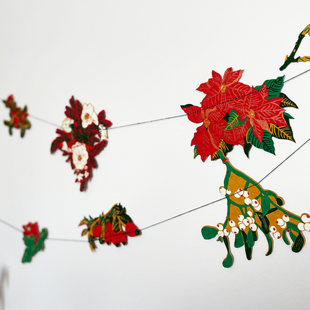 Decorative floral garland with red and green flowers on a white background. East End Press | Shop Fodder