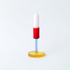 coloured glass candlestick holder on white background. 
