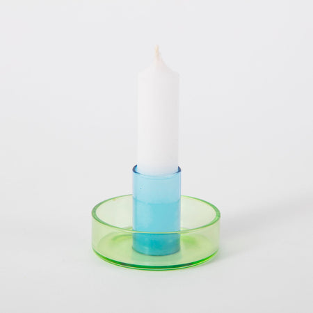 green and blue candlestick holder on white background. 