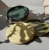 a stack of mixed coloured small plates. 