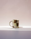 Ceramic mug with a geometric pattern on a white background. Fern Taylor Nerikomi Ceramics. Fodder