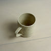 Handmade ceramic mug with a textured surface on a plain background | Fern Taylor Ceramics | Shop Fodder