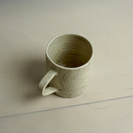 Handmade ceramic mug with a textured surface on a plain background | Fern Taylor Ceramics | Shop Fodder