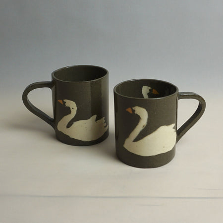Two brown mugs with white swan designs on a light grey background | Fern Taylor Ceramic Nerikomi Vase | Shop Fodder