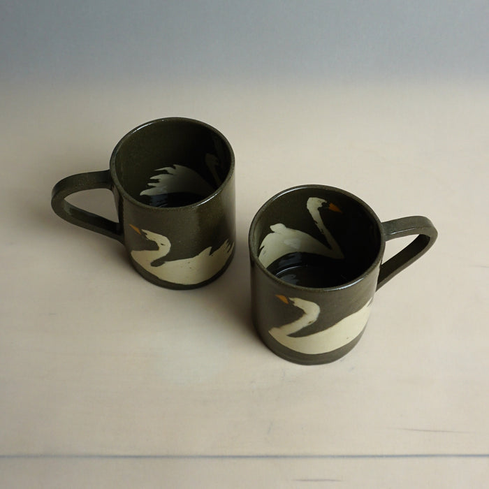 Two black mugs with bird designs on a light gray background | Fern Taylor Ceramics