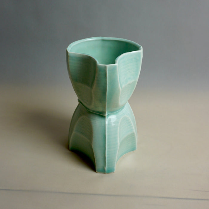 Green ceramic vase on a neutral background. Tessellating Pourer | Fettle Studio | Shop Fodder
