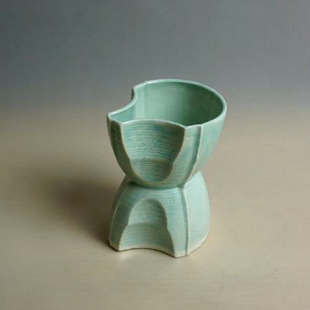 Green ceramic vase on a neutral background. Tessellating Pourer | Fettle Studio | Shop Fodder