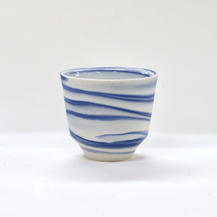 Ceramic cup with blue and white stripes on a white background | Janne MEijer | Shop Fodder