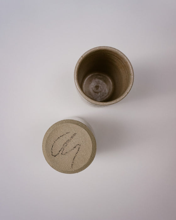 Maker Mark on a Ceramic Water cup by Cara Guthrie - birch wood ash glaze - handmade stoneware - Fodder