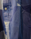 Close-up of a blue and white patterned button-up shirt, showing the fabric texture, buttons, and folds. Caroline Dickinson Shirt | Fodder