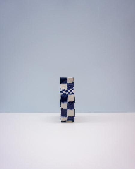 Checkered box with blue and white pattern on a light gray background. Nerikomi Vase | Fern Taylor | Shop Fodder