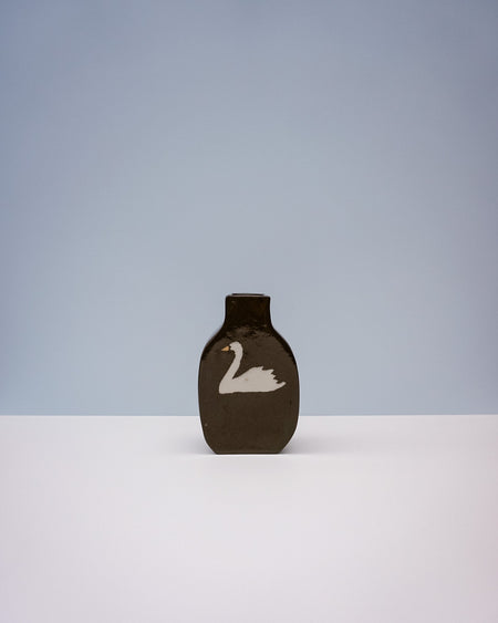 Brown ceramic vase with a white swan design on a light gray background. Nerikomi Vase | Fern Taylor | Shop Fodder