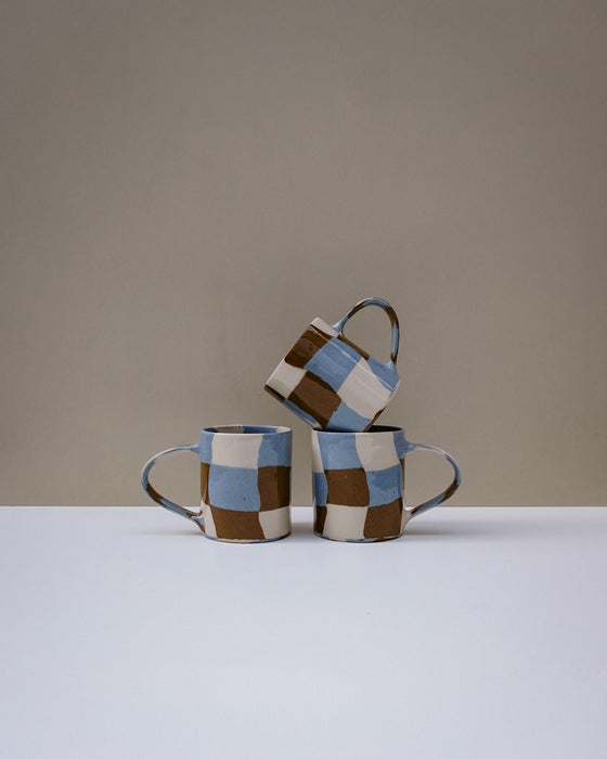 Handbuilt nerikomi check coffee mug by Fern Taylor in layered coloured stoneware. Fodder