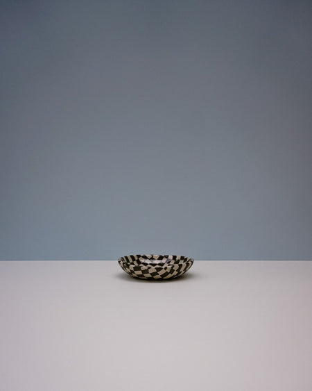 Small ceramic dish with black and white pattern on a light gray background. Fern Taylor | Nerikomi Dish | Shop Fodder