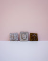 Sun wall tile by Lily Pearmain - 3D sun motif - tin white glaze - handmade stoneware - Fodder