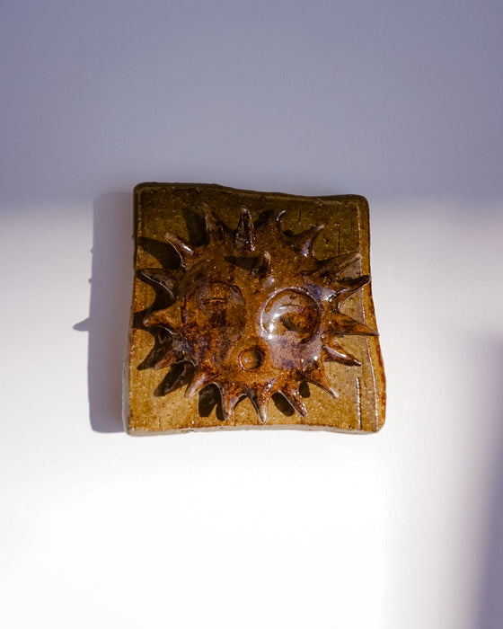 Close up of raised sun and glaze texture - Lily Pearmain | Fodder
