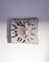 Close up of raised sun and glaze texture - Lily Pearmain | Fodder