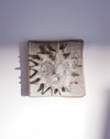 Close up of raised sun and glaze texture - Lily Pearmain | Fodder