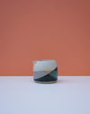 Ceramic pitcher with geometric design on a peach and white background. Liz Vidal Ceramics | Shop Fodder