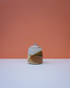 Ceramic vase with a geometric design on a peach background. Liz Vidal Ceramics | Shop Fodder