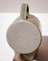 Close-up of a ceramic mug showing the textured, speckled light gray bottom and the handle, with the brand name 'scree' printed on the side, set against a neutral beige background. Everyday Mug | Scree Ceramics | Fodder