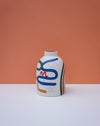 Decorative vase with abstract design on a peach background. Sophie Alda | Handmade Ceramics | Shop Fodder