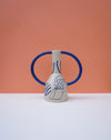Ceramic vase with blue handles and abstract design on a peach background. Sophie Alda | Handmade Ceramics | Shop Fodder