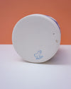 White container with blue lid on a white surface against an orange background. Sophie Alda | Handmade Ceramics | Shop Fodder