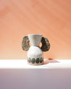 Ceramic vase with dog ears on a peach background. Sophie Alda | Handmade Ceramics | Shop Fodder