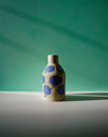 Ceramic vase with blue floral patterns on a green background. Sophie Alda | Handmade Ceramics | Shop Fodder