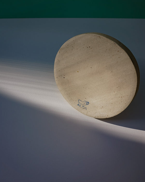 Round stone object with 'Sophie Alda' branding on a gradient background. Sophie Alda | Handmade Ceramics | Shop Fodder