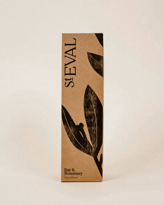 A tall rectangular kraft paper box for stEVAL Bay & Rosemary sand diffuser, featuring black leaf illustrations and the brand name 'stEVAL' printed vertically on a warm beige background.