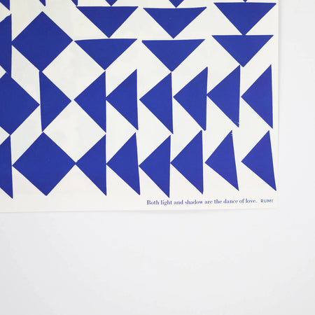 geometric blue and white gift wrap on a white background by Hadley Paper Goods. 